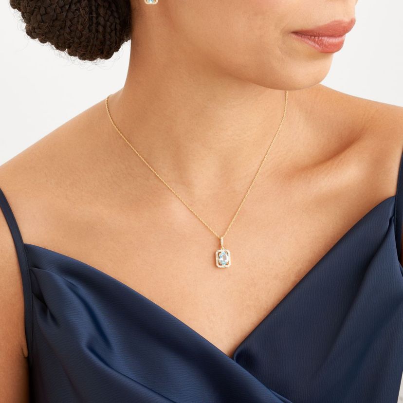 Genuine Blue Topaz and Created White Sapphire Halo Necklace and Earring Set in 18K Gold over Sterling Silver