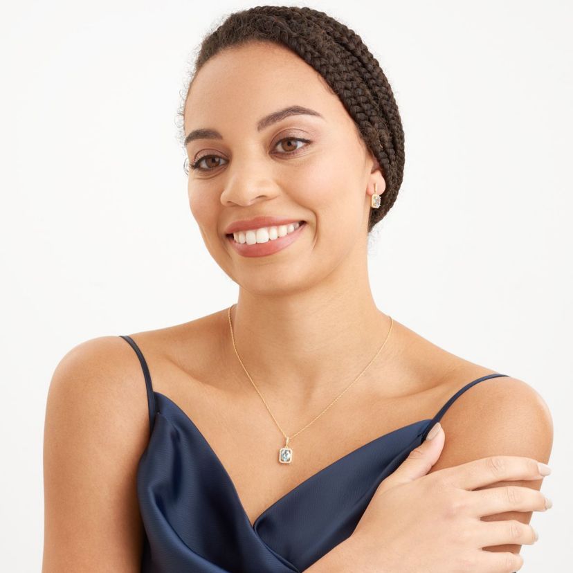 Genuine Blue Topaz and Created White Sapphire Halo Necklace and Earring Set in 18K Gold over Sterling Silver