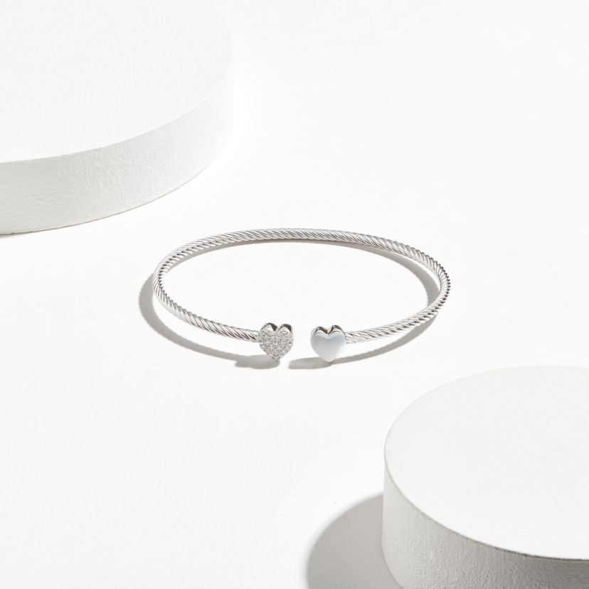 1/10 cttw Diamond Twin Heart Open Cuff Twisted Bangle in Rhodium Plated Sterling Silver