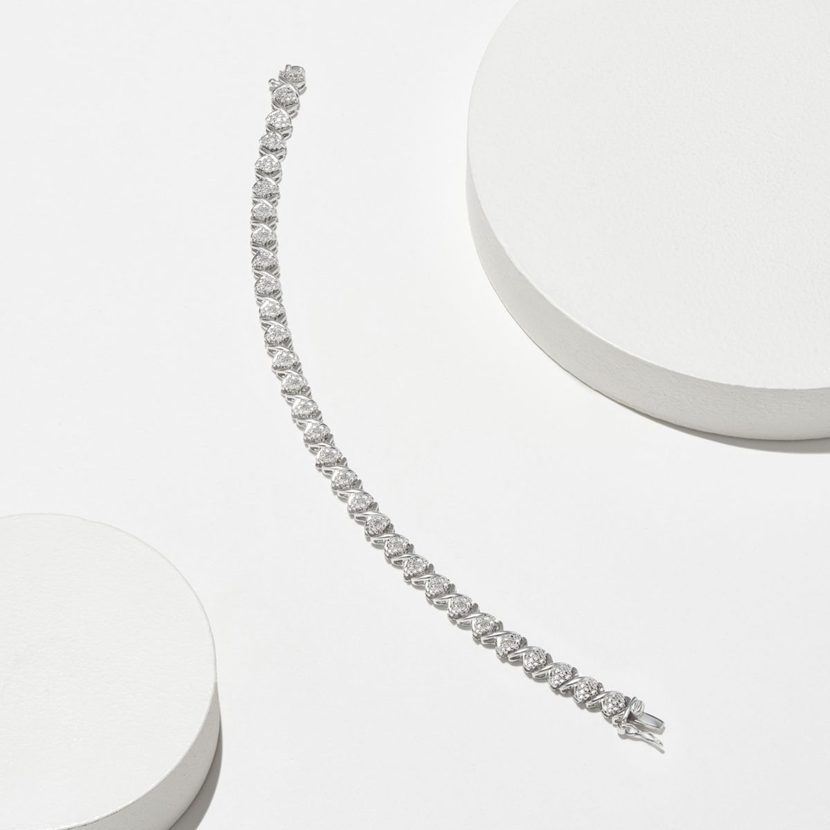 1/10cttw Diamond X Tennis Bracelet in Rhodium Plated Sterling Silver