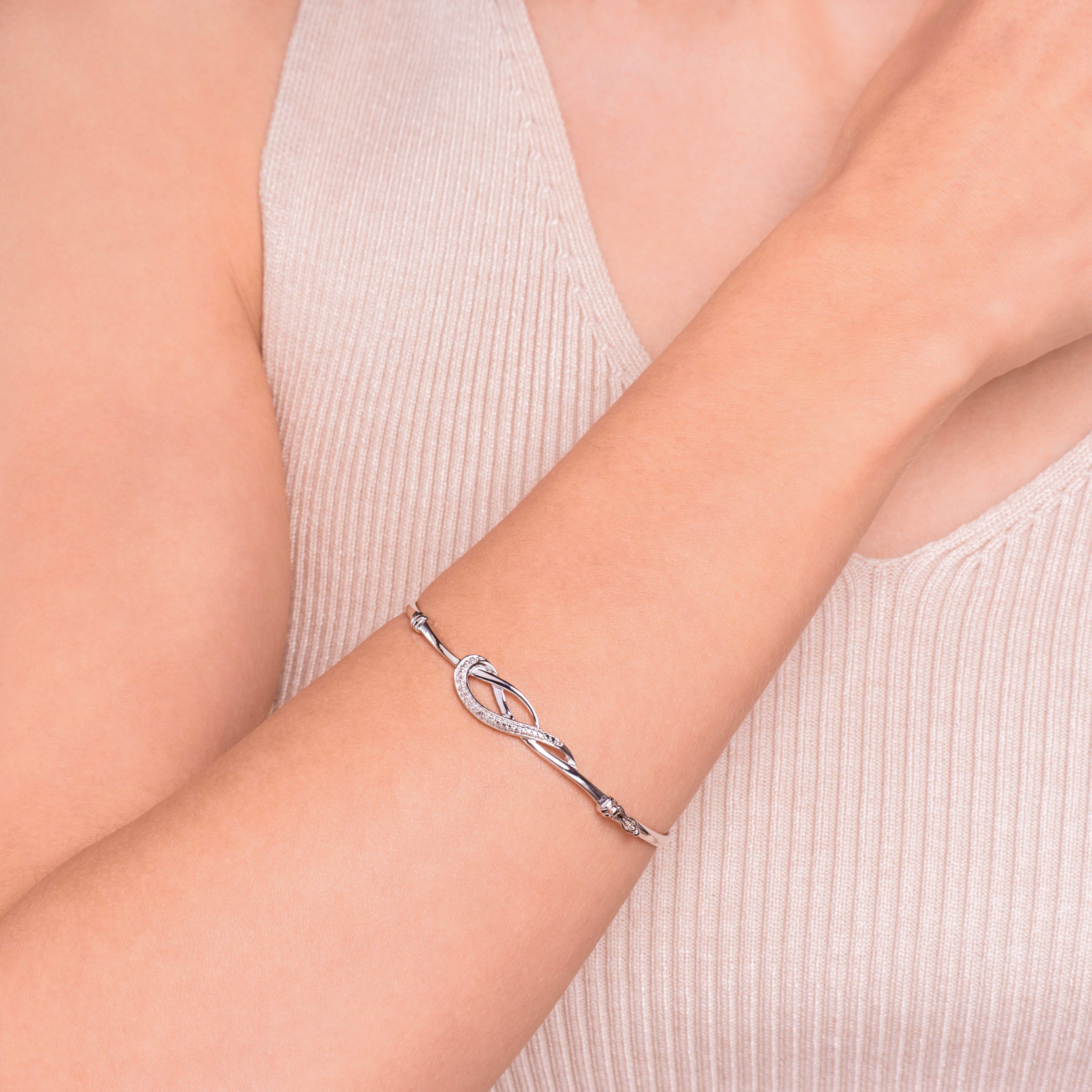 Diamond Accent Infinity Swirl Bangle Bracelet in Rhodium Plated Sterling Silver