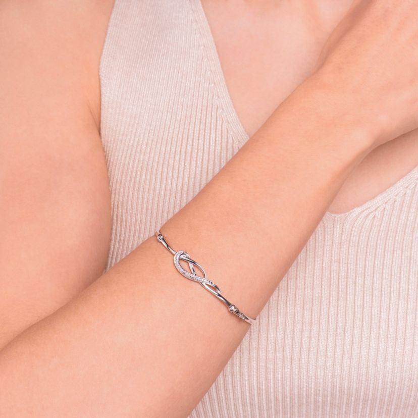 Diamond Accent Infinity Swirl Bangle Bracelet in Rhodium Plated Sterling Silver