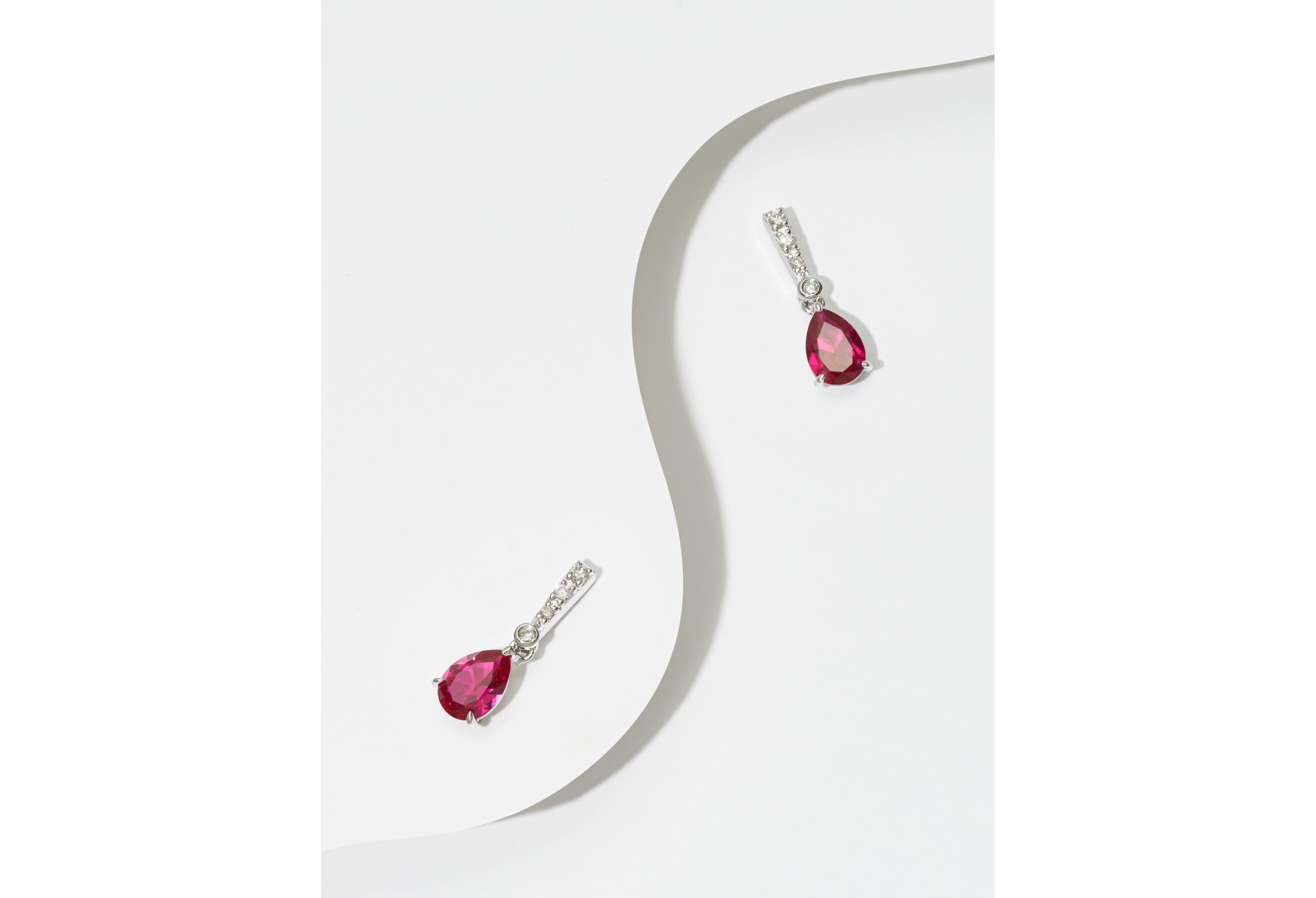 Lab Created Diamond and Ruby Pear Drop Stud Earrings in Rhodium Plated Sterling Silver