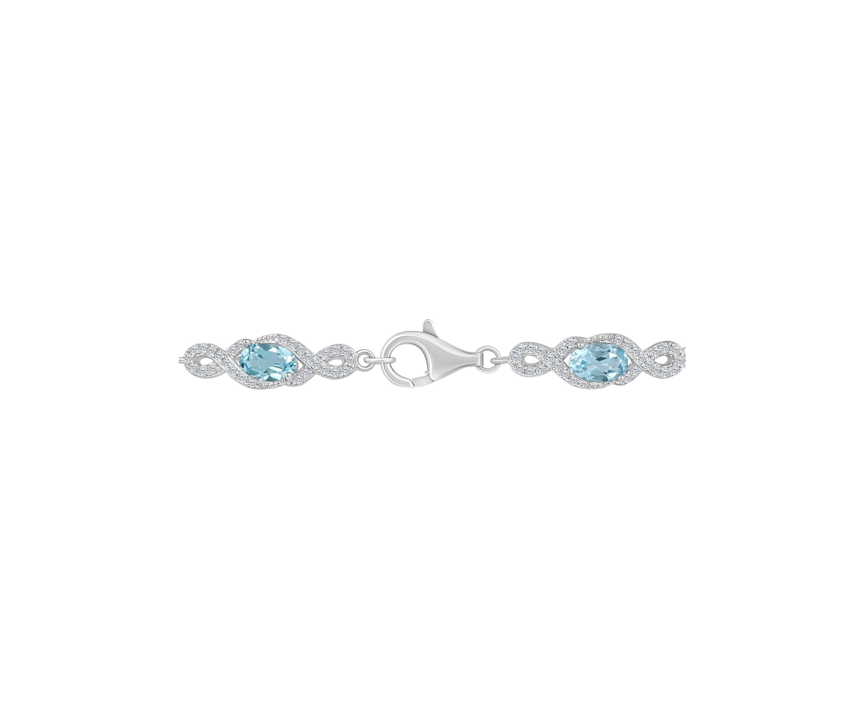 Sterling Silver 6x4mm Oval Sky Blue Topaz and White Topaz Accent Bracelet