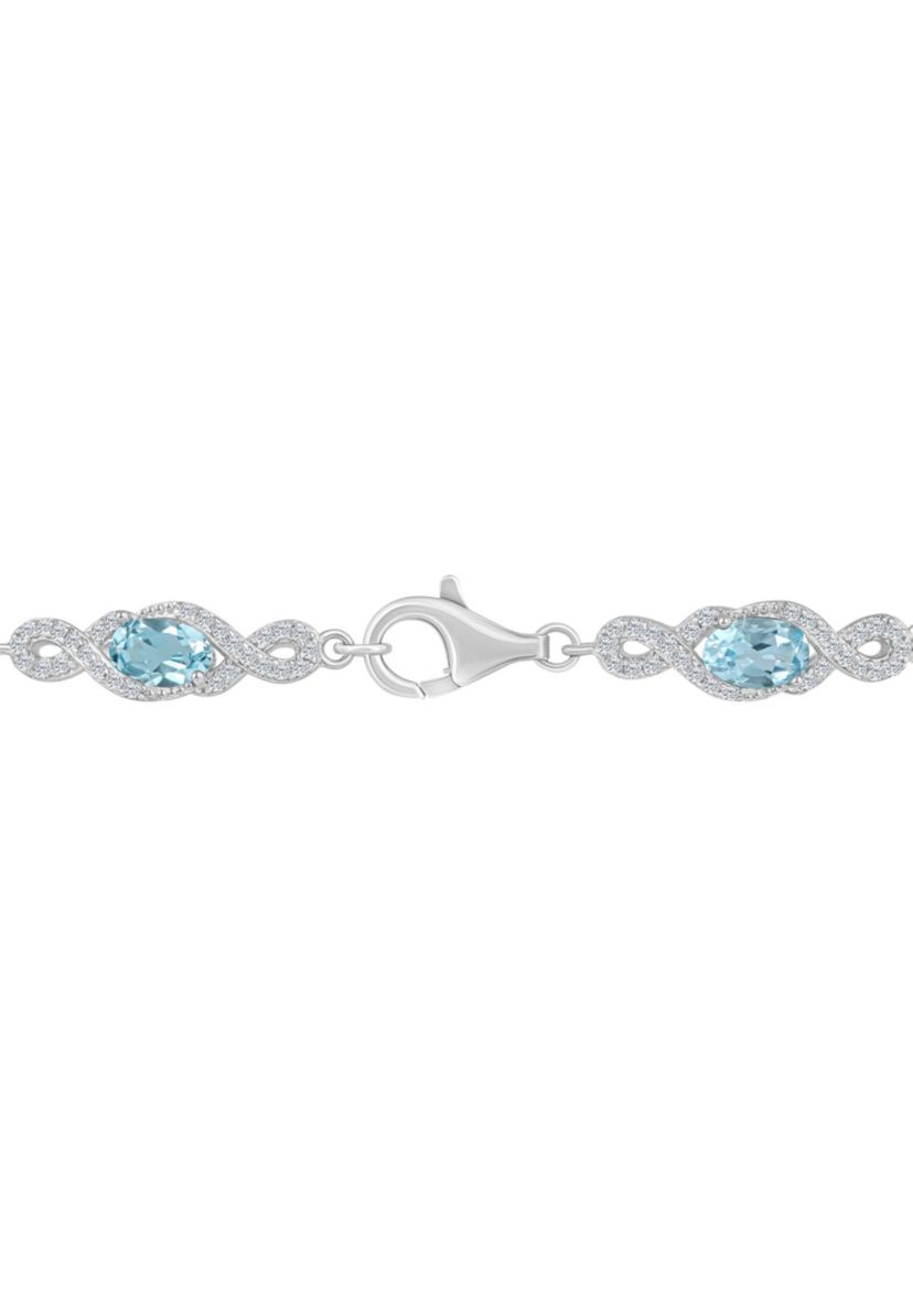 Sterling Silver 6x4mm Oval Sky Blue Topaz and White Topaz Accent Bracelet