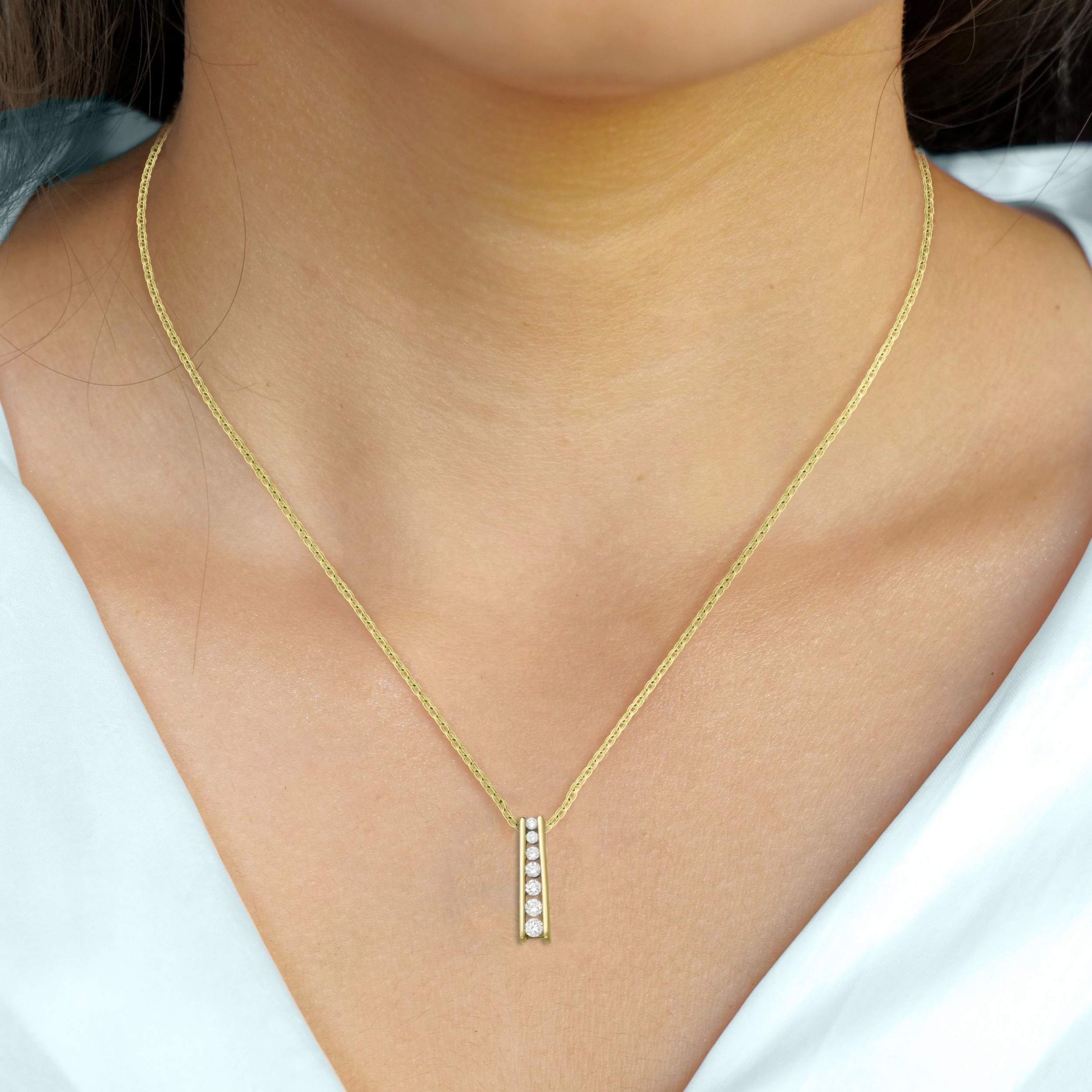 Lab Created 0.20CTTW DIAMOND JOURNEY PENDANT IN 10KY