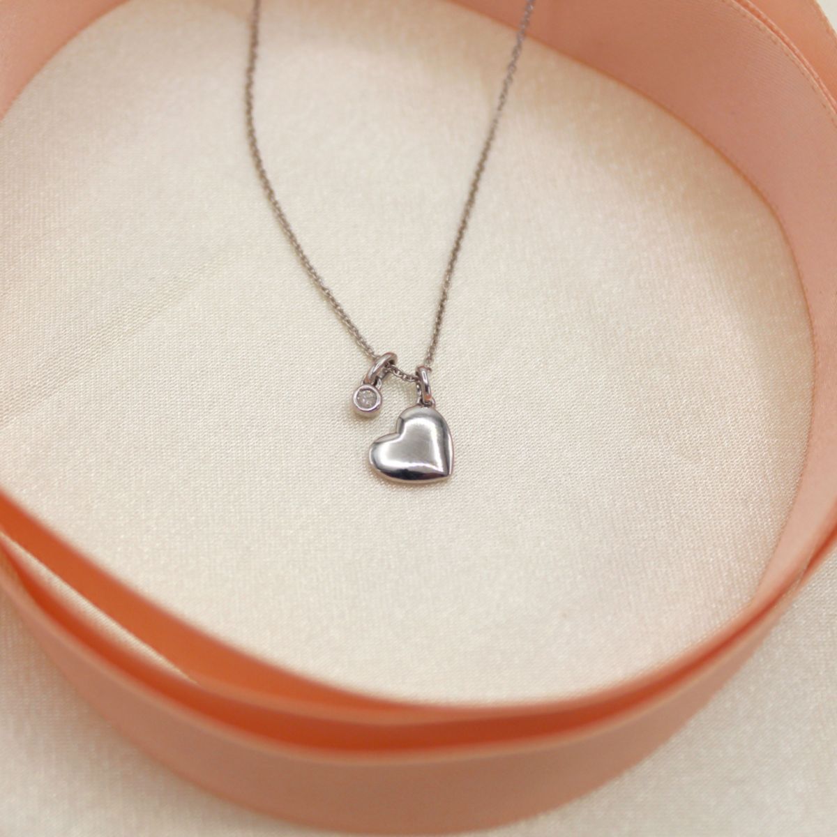 1/20 ct. t.w. Natural Diamond Floating Heart Pendant set in 925 Sterling Silver with 18" Cable Chain