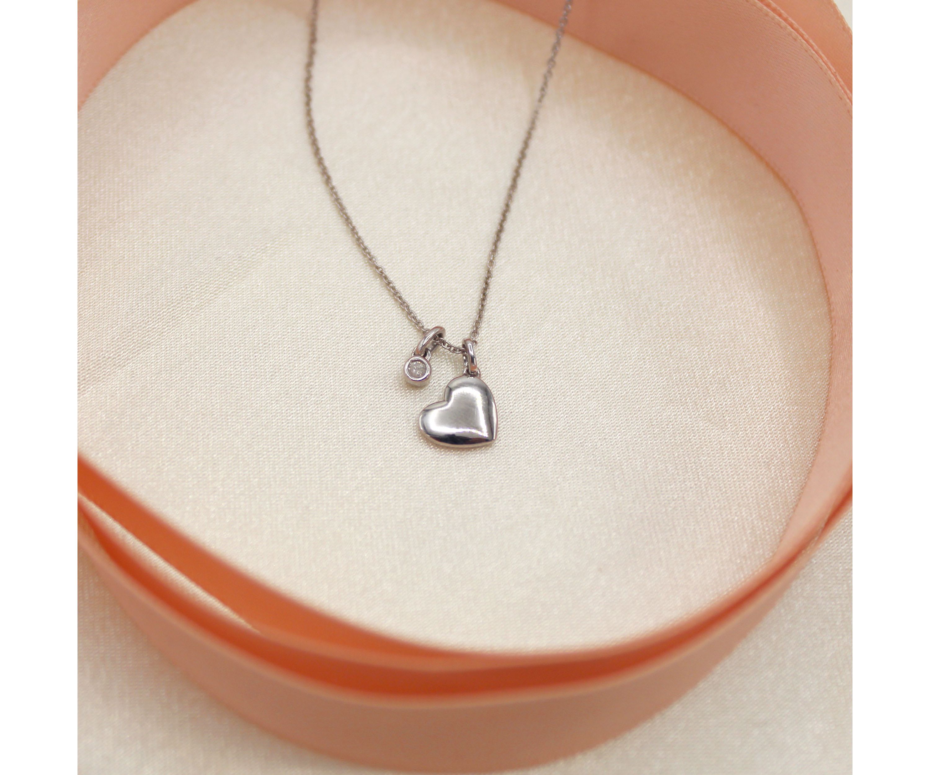 1/20 ct. t.w. Natural Diamond Floating Heart Pendant set in 925 Sterling Silver with 18" Cable Chain