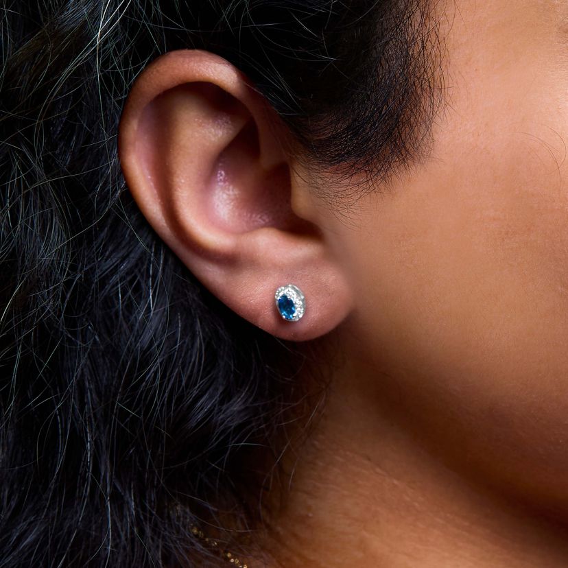10K White Gold 5x3 MM Oval Blue Topaz and Diamond Halo Stud Earrings