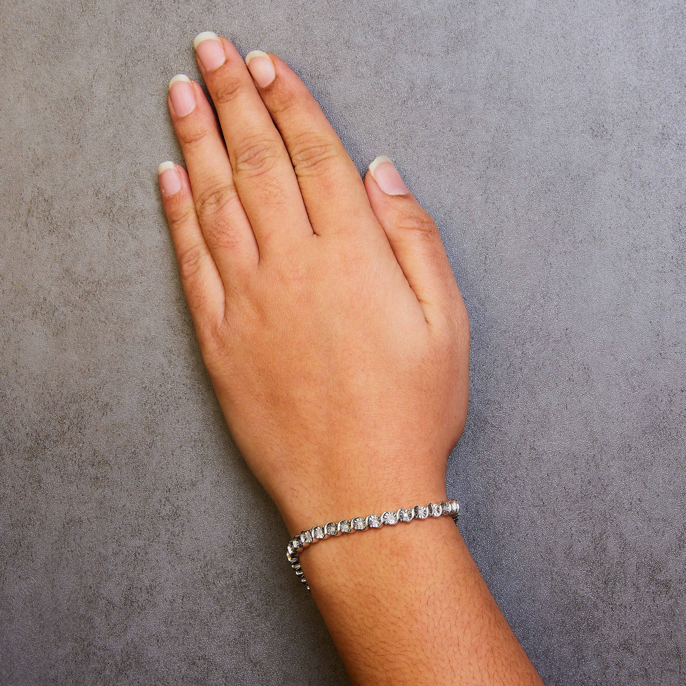 .925 Sterling Silver 1/4 Cttw Diamond and "S" Link Tennis Bracelet