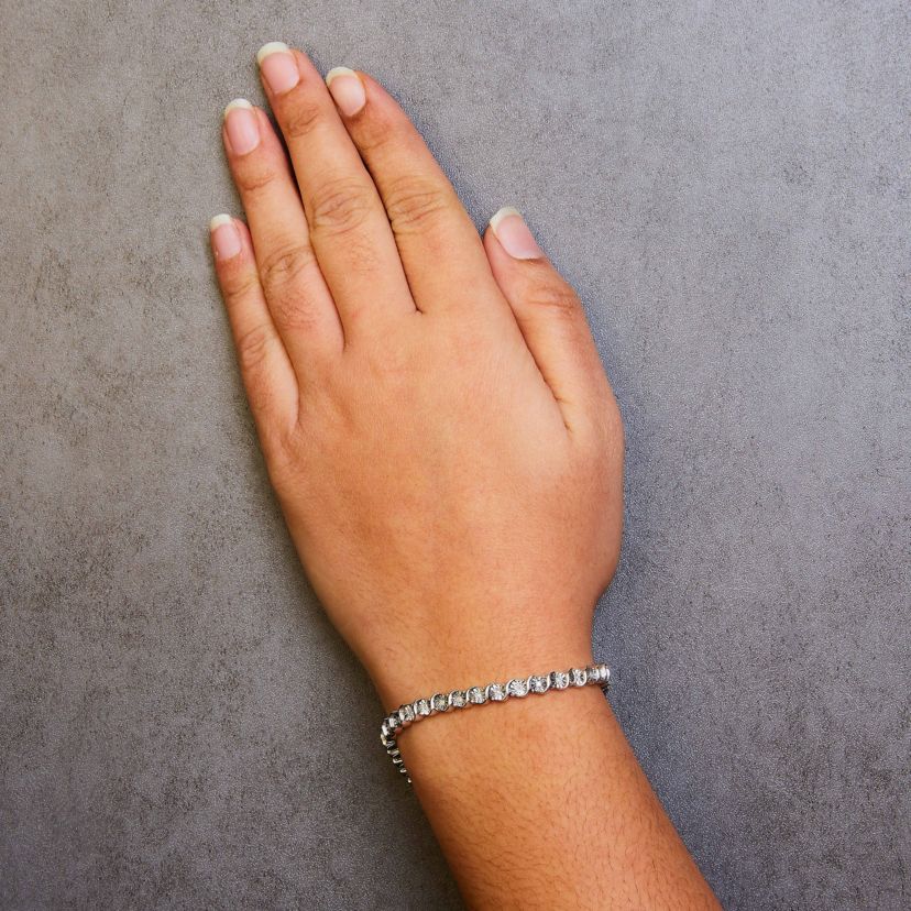 .925 Sterling Silver 1/4 Cttw Diamond and "S" Link Tennis Bracelet