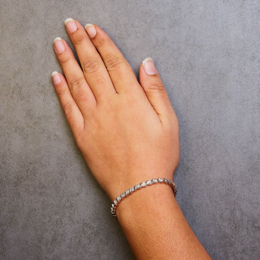 .925 Sterling Silver 1/4 Cttw Diamond and "S" Link Tennis Bracelet