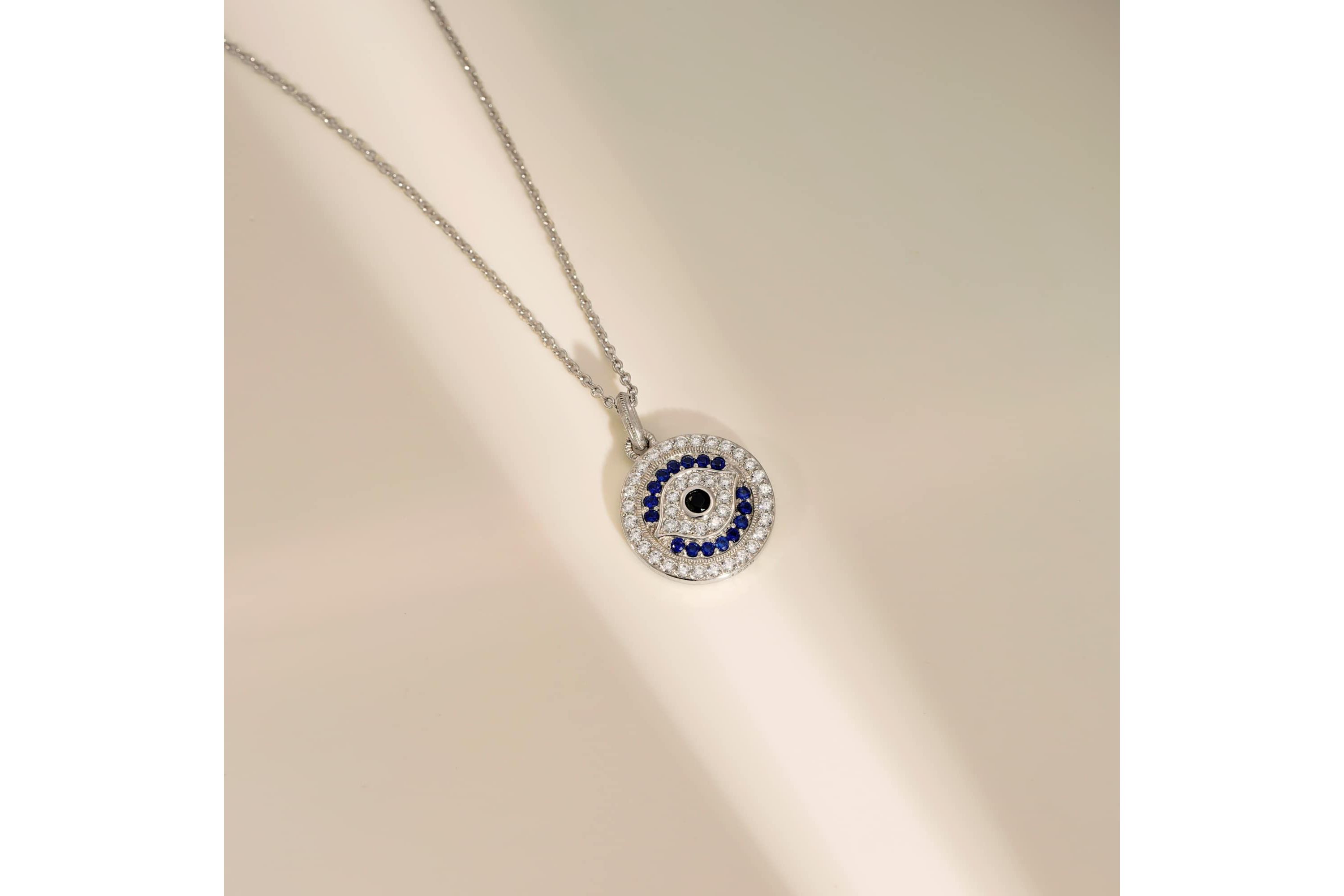 Lab Created Platinum Plated Sterling Silver Synthetic Sapphire and Clear Cubic Zirconia Round Evil Eye Pendant Necklace