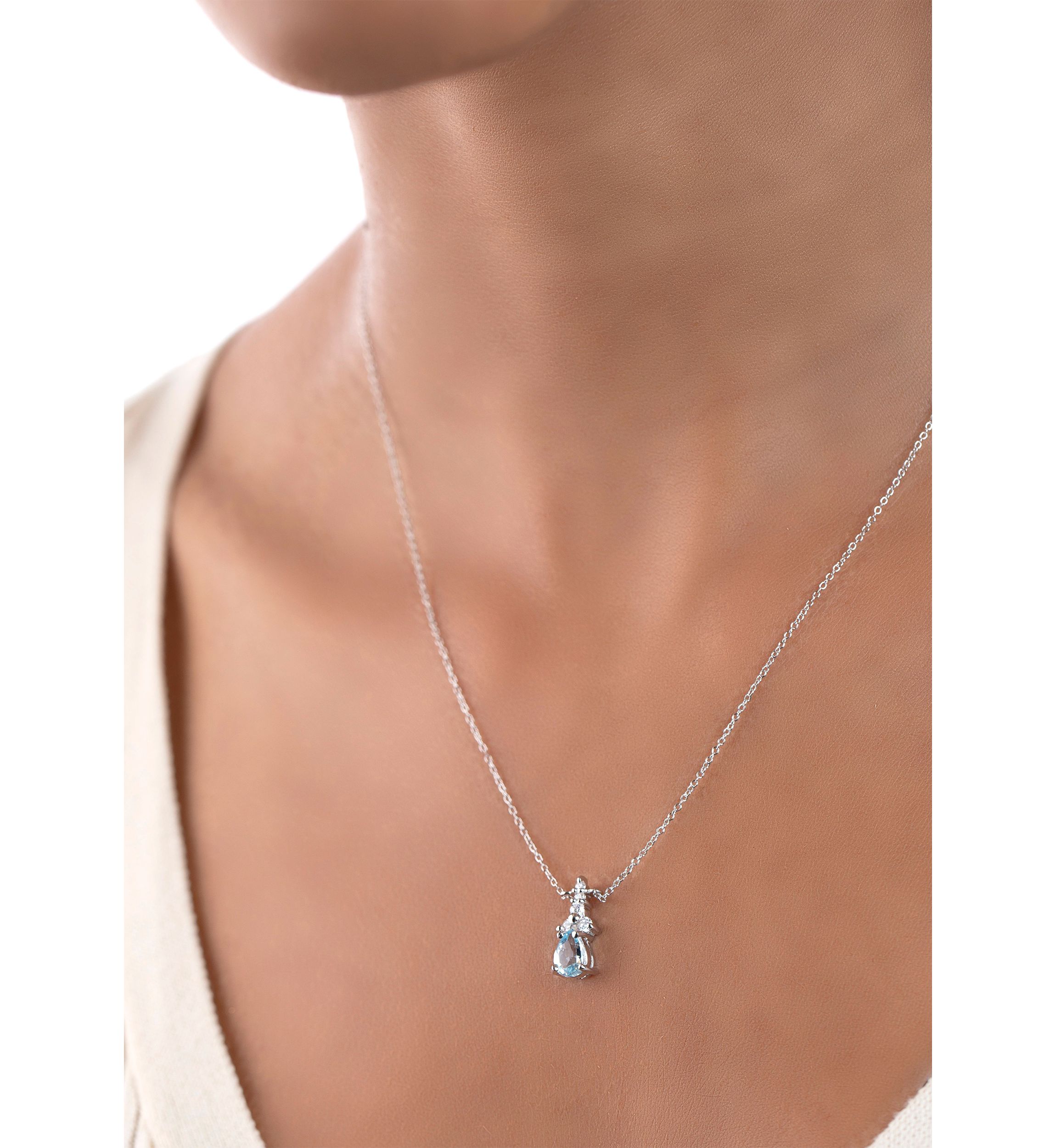 Sterling Silver Pear Cut Blue Topaz and Cubic Zirconia Necklace