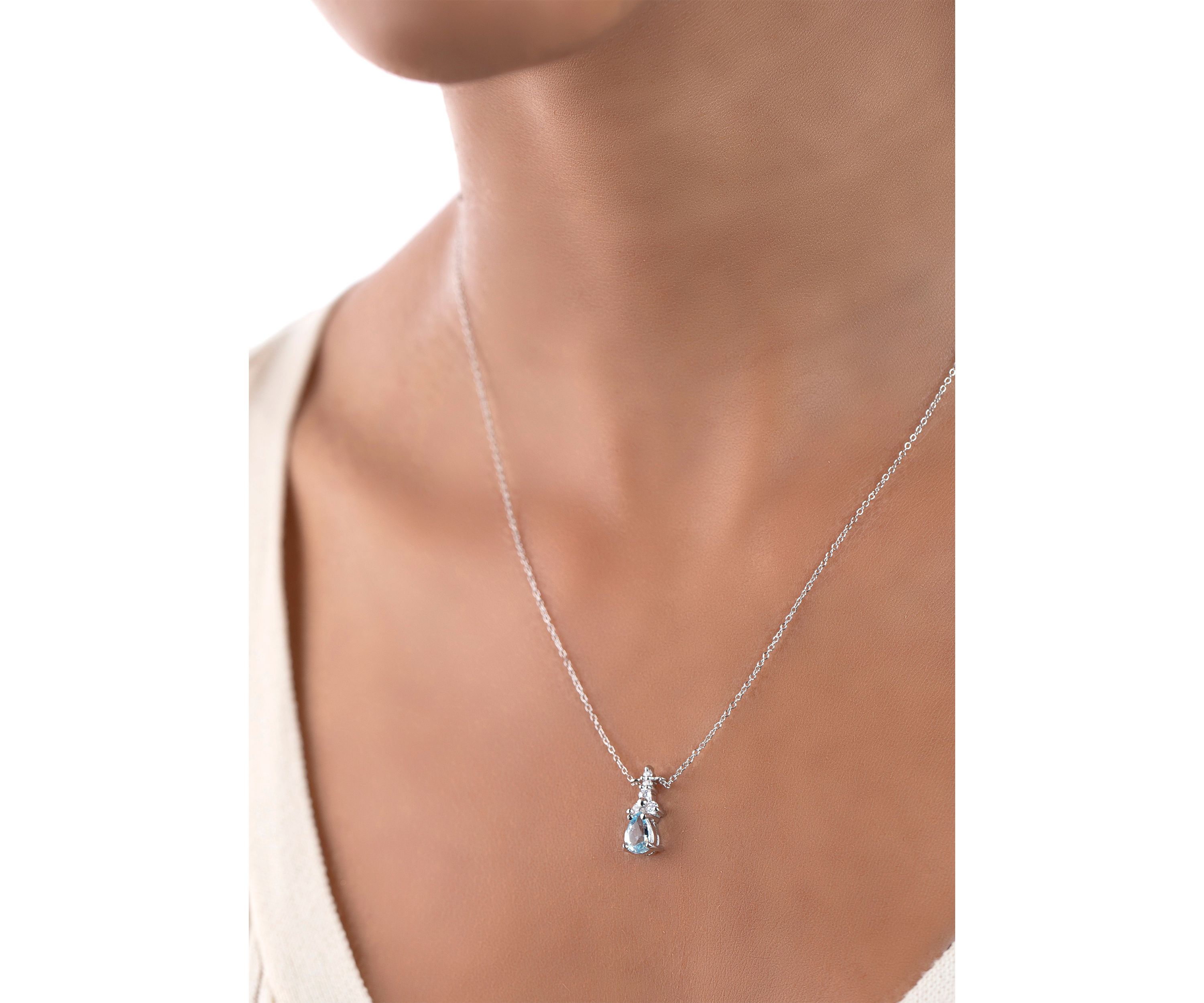 Sterling Silver Pear Cut Blue Topaz and Cubic Zirconia Necklace
