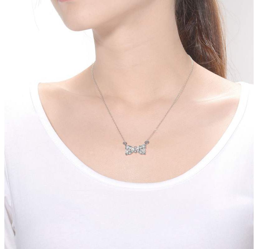 Sterling Silver White Gold Plated with 1.50ctw Lab Created Moissanite Bow-Tie Pendant Necklace
