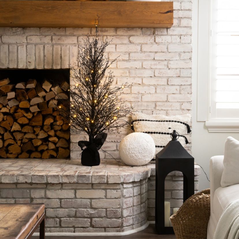 4ft. Pre-Lit Halloween Black Twig Artificial Fall Tree in Burlap Planter with 63 Warm White LED Lights