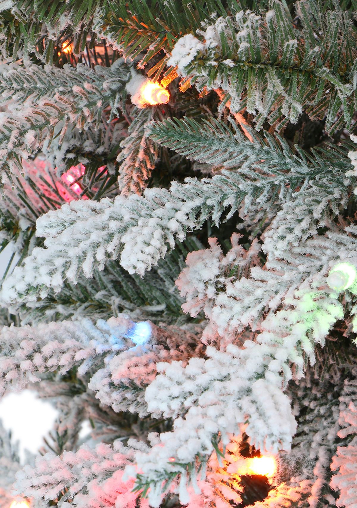 4.5 ft Pre-Lit Potted Flocked Arctic Fir Artificial Christmas Tree with 70 UL Multi-Color Lights Green