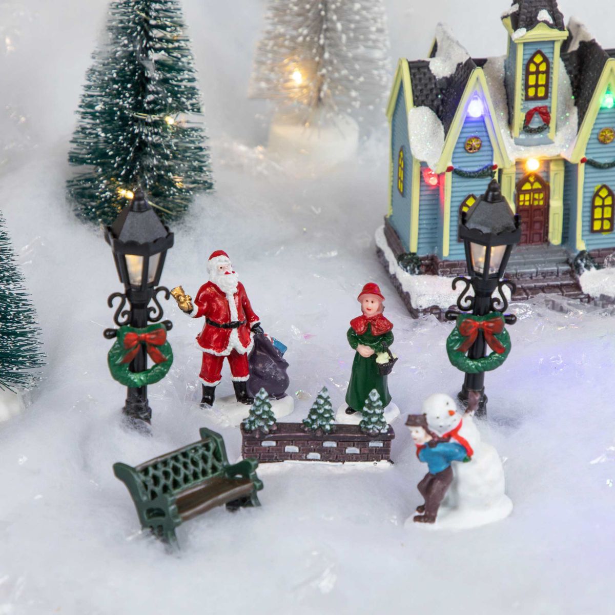 7-Piece Christmas Village Figurine and Tree Display Set