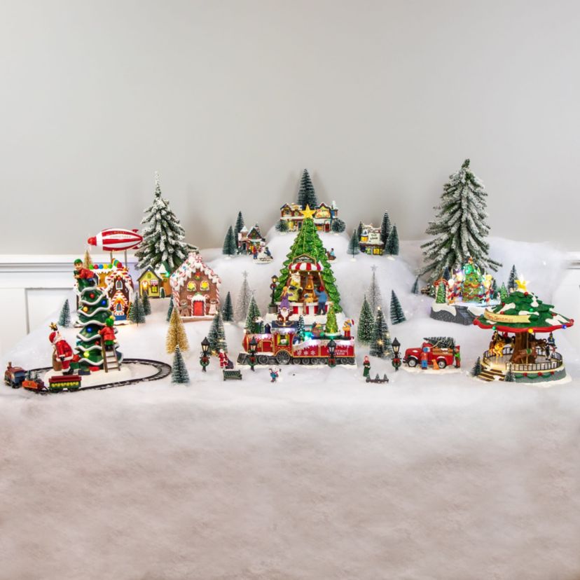 7-Piece Christmas Village Figurine and Tree Display Set