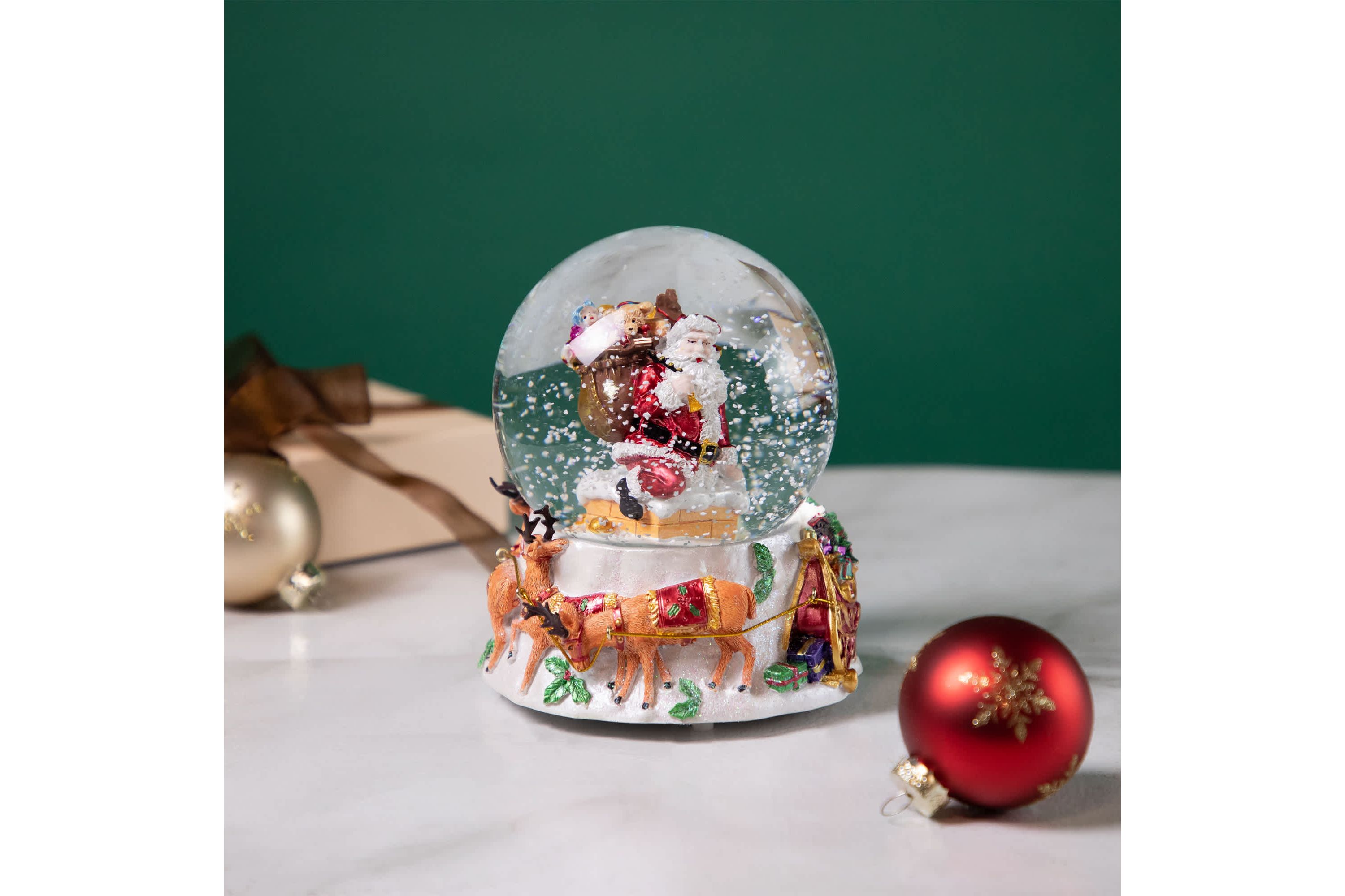 6.5" Santa Delivering Gifts Musical Christmas Snow Globe