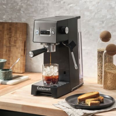 Compact stainless espresso machine photographed against a white background