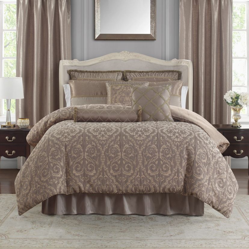 The rich Waterford Fine Linens Hazeldene bedding set is a beautiful allover taupe design. The woven jacquard comforter has a pucker construction creating exquisite dimension. Coordinating pillow shams add shine and are finished with an elegant accent and corded trim.   Included in the set is a ruffled taupe bedskirt and textured euro shams with a ruched border and fringe accent reversing to an hourglass design.  Queen dimensions: Comforter 92" x 96", Std Sham 20" x 26",  European Sham 26" x 26" Bed Skirt 60" x 80" with 16" drop, King dimensions: Comforter 110" x 96", King Shams 20" x 36", European shams 26" x 26" and Bed Skirt 72" x 84" with 16" drop.  Dry Clean Only.