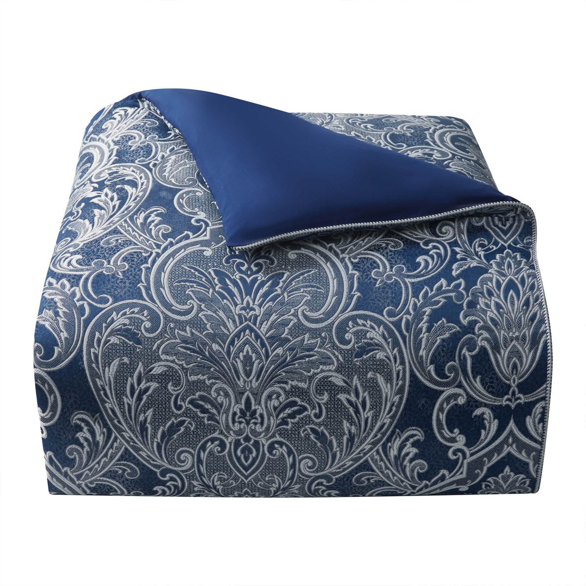 The elegant Waterford Blarney bedding set is an exquisite woven jacquard in blue with ivory accents.   The comforter and matching pillow shams feature a multi layer jacquard with a blooming arabesque design . Add a contemporary feel with the center pleat bedskirt in blue with a small pebble woven design. Included in the four piece set is the comforter, two pillow shams and bedskirt.