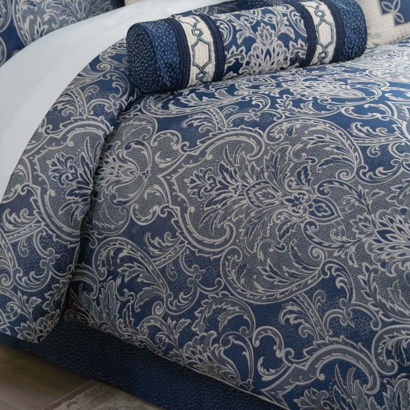 The elegant Waterford Blarney bedding set is an exquisite woven jacquard in blue with ivory accents.   The comforter and matching pillow shams feature a multi layer jacquard with a blooming arabesque design . Add a contemporary feel with the center pleat bedskirt in blue with a small pebble woven design. Included in the four piece set is the comforter, two pillow shams and bedskirt.