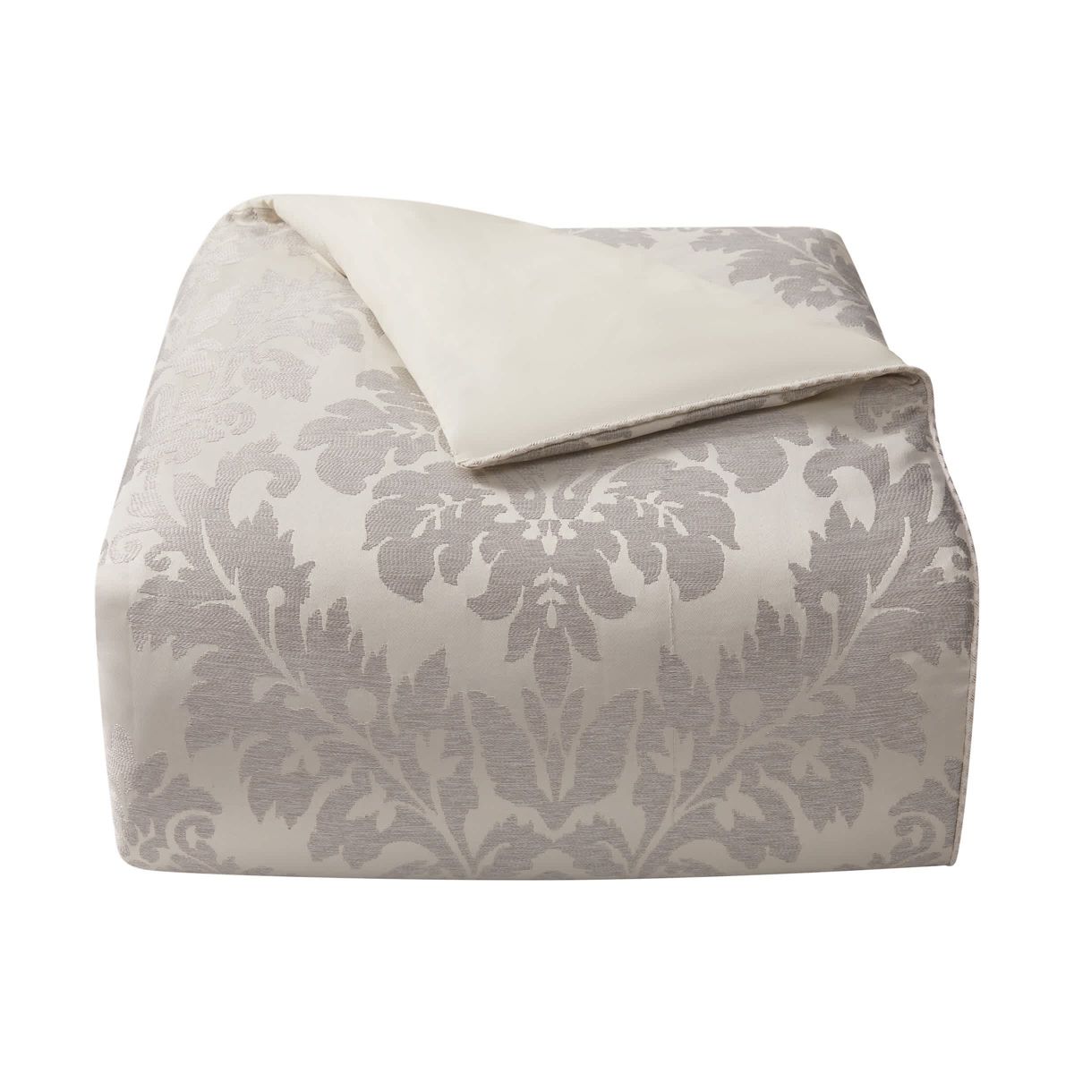 The large scale woven damask with an hourglass design provides a stunning update to your bedroom. The ivory and platinum four piece set includes a comforter with matching pillow shams and center pleat bedskirt.