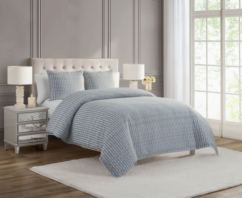 The Waterford Aretha Blue 3-Piece Comforter Set is the epitome of refined luxury, designed to bring a sense of serenity and sophistication to your bedroom. This elegant set includes a beautifully crafted comforter and two coordinating shams, all featuring a rich, soothing blue tone that complements a wide range of bedroom styles. The comforter’s intricate pattern, subtle  texture and depth, creates a timeless, opulent look that is both classic and contemporary. Expertly constructed from high-quality fabrics, this comforter set offers a soft, luxurious feel while providing exceptional warmth and comfort for a restful night’s sleep. The Waterford Aretha Blue Comforter Set is perfect for those seeking to add a touch of elegance to their master bedroom, guest room, or even a chic hotel-inspired retreat. Durable and easy to care for, this set is not only a stunning visual addition to your space but also a practical one. With its combination of craftsmanship, style, and comfort, the Waterford Aretha Blue 3-Piece Comforter Set offers lasting beauty and luxury for your home. Elevate your bedroom decor today with this exquisite set and indulge in the ultimate in sophisticated bedding.