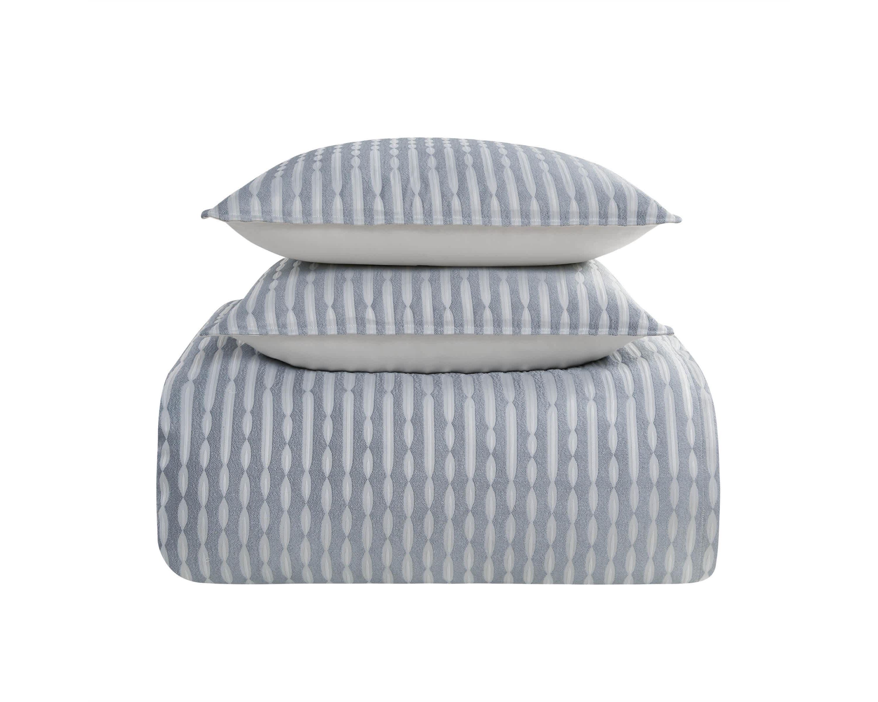 The Waterford Aretha Blue 3-Piece Comforter Set is the epitome of refined luxury, designed to bring a sense of serenity and sophistication to your bedroom. This elegant set includes a beautifully crafted comforter and two coordinating shams, all featuring a rich, soothing blue tone that complements a wide range of bedroom styles. The comforter’s intricate pattern, subtle  texture and depth, creates a timeless, opulent look that is both classic and contemporary. Expertly constructed from high-quality fabrics, this comforter set offers a soft, luxurious feel while providing exceptional warmth and comfort for a restful night’s sleep. The Waterford Aretha Blue Comforter Set is perfect for those seeking to add a touch of elegance to their master bedroom, guest room, or even a chic hotel-inspired retreat. Durable and easy to care for, this set is not only a stunning visual addition to your space but also a practical one. With its combination of craftsmanship, style, and comfort, the Waterford Aretha Blue 3-Piece Comforter Set offers lasting beauty and luxury for your home. Elevate your bedroom decor today with this exquisite set and indulge in the ultimate in sophisticated bedding.