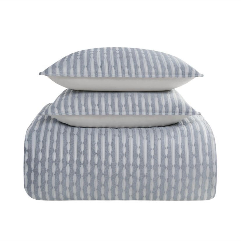The Waterford Aretha Blue 3-Piece Comforter Set is the epitome of refined luxury, designed to bring a sense of serenity and sophistication to your bedroom. This elegant set includes a beautifully crafted comforter and two coordinating shams, all featuring a rich, soothing blue tone that complements a wide range of bedroom styles. The comforter’s intricate pattern, subtle  texture and depth, creates a timeless, opulent look that is both classic and contemporary. Expertly constructed from high-quality fabrics, this comforter set offers a soft, luxurious feel while providing exceptional warmth and comfort for a restful night’s sleep. The Waterford Aretha Blue Comforter Set is perfect for those seeking to add a touch of elegance to their master bedroom, guest room, or even a chic hotel-inspired retreat. Durable and easy to care for, this set is not only a stunning visual addition to your space but also a practical one. With its combination of craftsmanship, style, and comfort, the Waterford Aretha Blue 3-Piece Comforter Set offers lasting beauty and luxury for your home. Elevate your bedroom decor today with this exquisite set and indulge in the ultimate in sophisticated bedding.