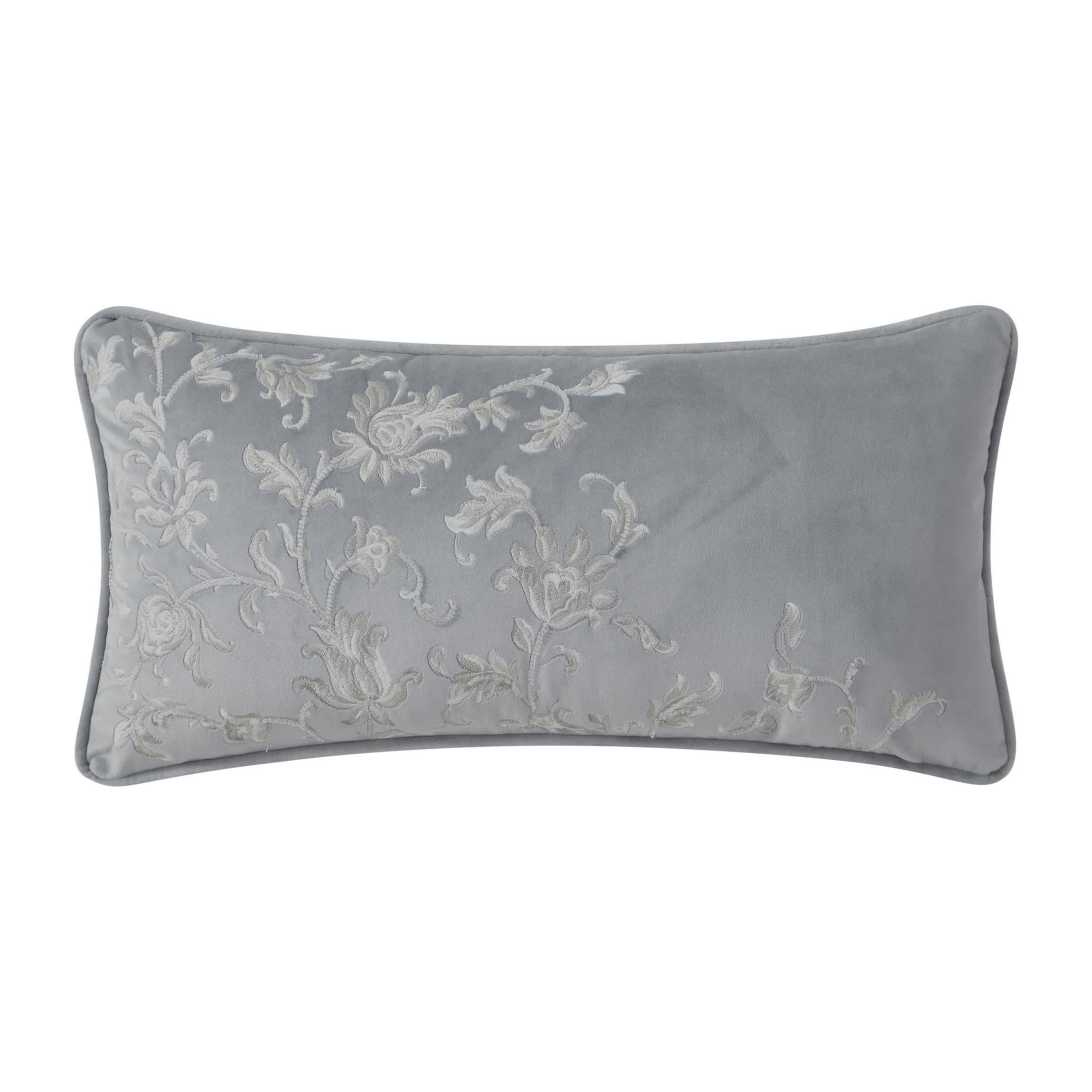 The Blenheim 11" x 22" soft velvet decorative pillow is adorned with exquisite floral embroidery with subtle beading detail. The pillow reverses to a solid velvet in platinum grey and is finished with a self fabric cording.
