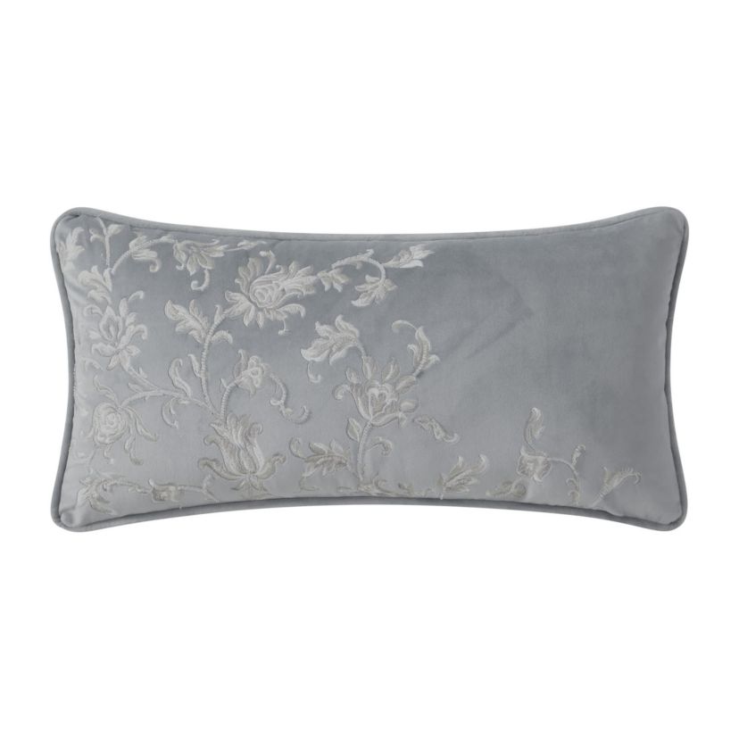 The Blenheim 11" x 22" soft velvet decorative pillow is adorned with exquisite floral embroidery with subtle beading detail. The pillow reverses to a solid velvet in platinum grey and is finished with a self fabric cording.