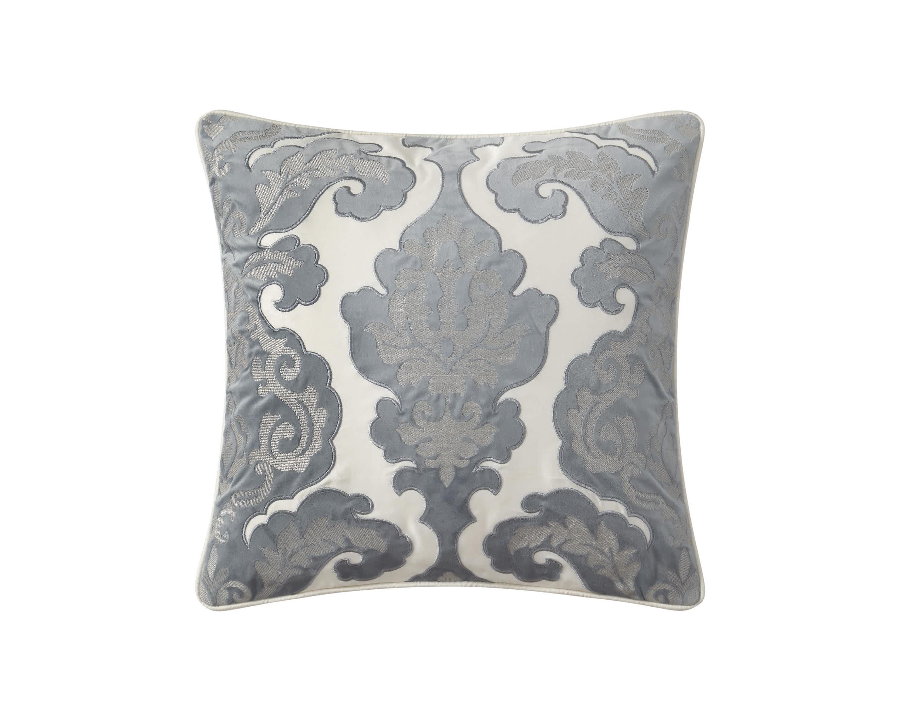 This 18" x 18" applique pillow from the Waterford Blenheim collection features an engineered damask pattern applique atop a solid ivory sateen. The pillow is finished with a four sided self cording and reverses to solid ivory.