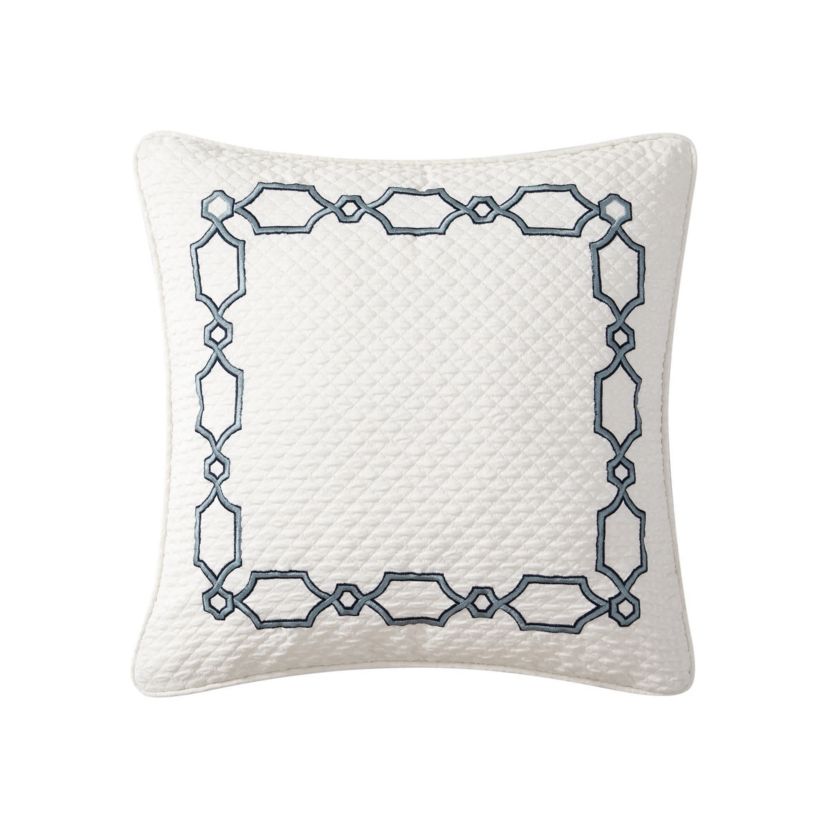 The oversized 20" x 20"Blarney decorative pillow has an ivory quilted front with a wide embroidered detail border in navy. The navy reverse features a small woven design.
