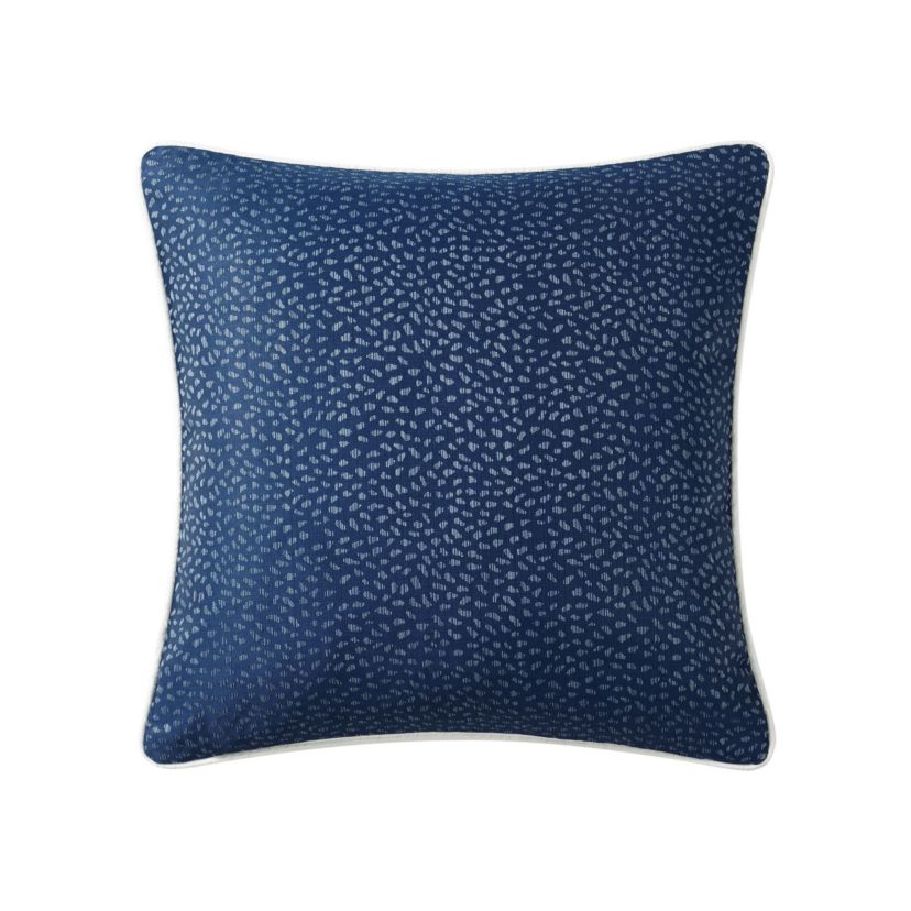 The oversized 20" x 20"Blarney decorative pillow has an ivory quilted front with a wide embroidered detail border in navy. The navy reverse features a small woven design.