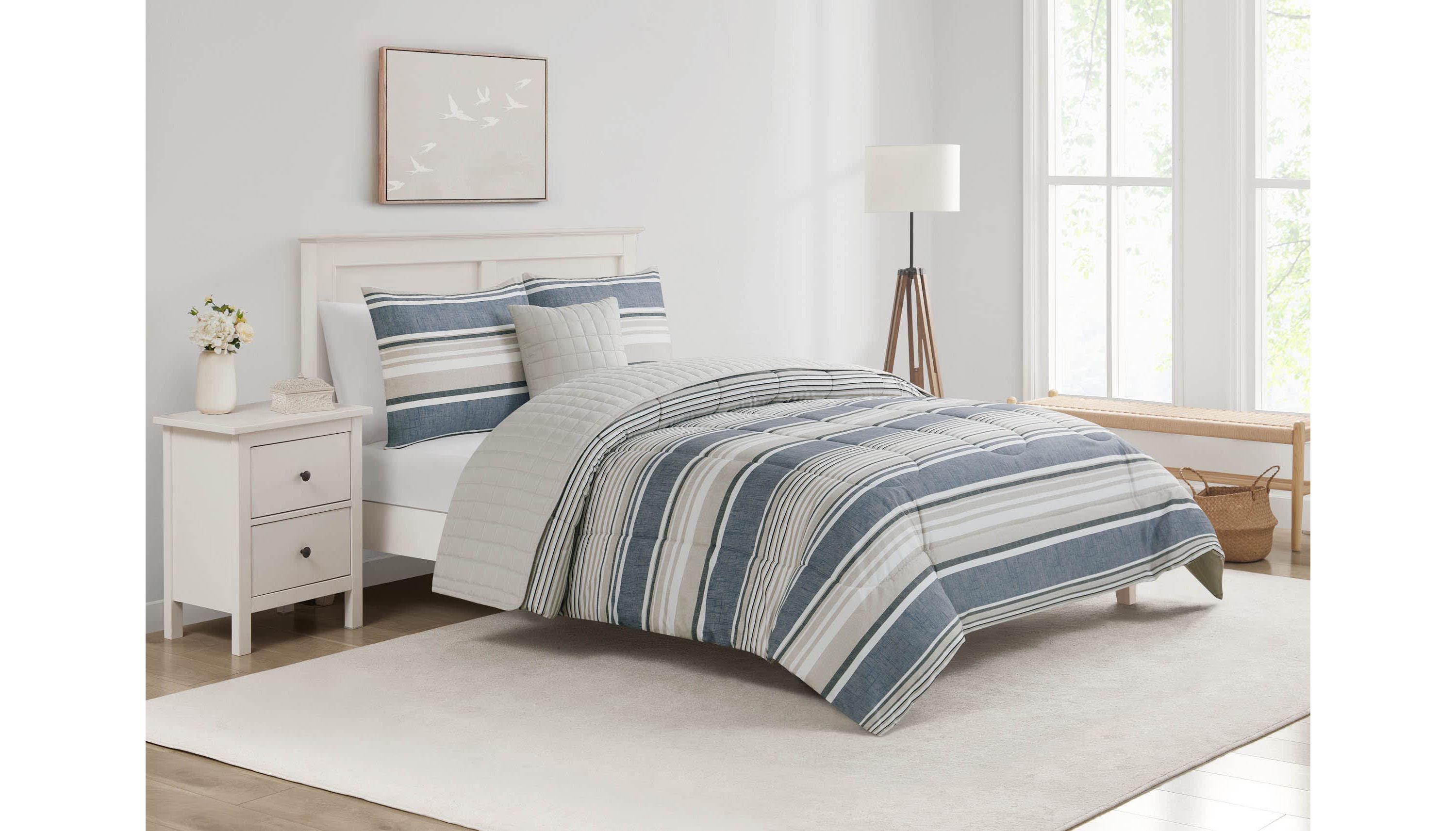 Refresh your space with the Easton Stripe 5pc Comforter and Quilt Set. Featuring classic stripes in blue, gray, and ivory, this set includes a cozy comforter, quilt, 2 shams, and a decorative pillow—perfect for effortless, layered style and year-round comfort.