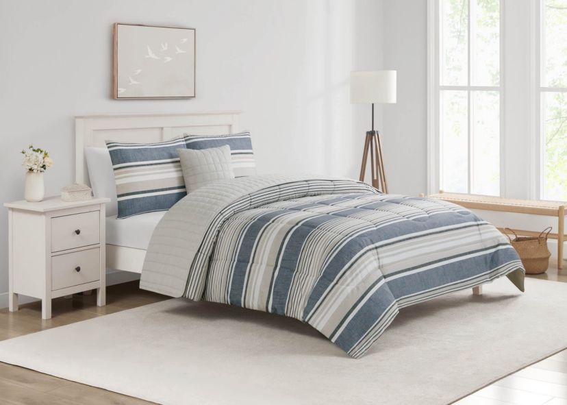 Refresh your space with the Easton Stripe 5pc Comforter and Quilt Set. Featuring classic stripes in blue, gray, and ivory, this set includes a cozy comforter, quilt, 2 shams, and a decorative pillow—perfect for effortless, layered style and year-round comfort.