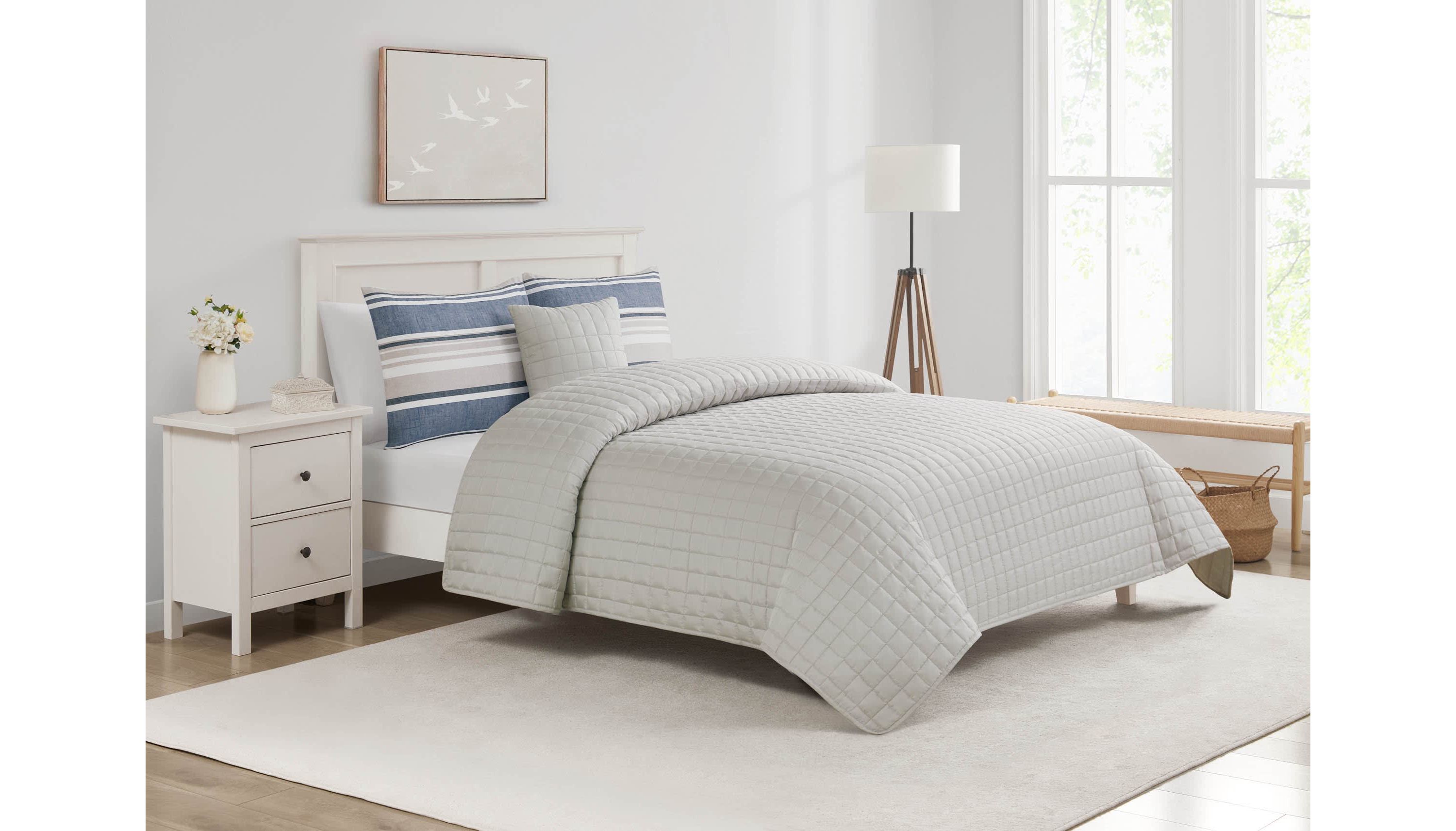 Refresh your space with the Easton Stripe 5pc Comforter and Quilt Set. Featuring classic stripes in blue, gray, and ivory, this set includes a cozy comforter, quilt, 2 shams, and a decorative pillow—perfect for effortless, layered style and year-round comfort.