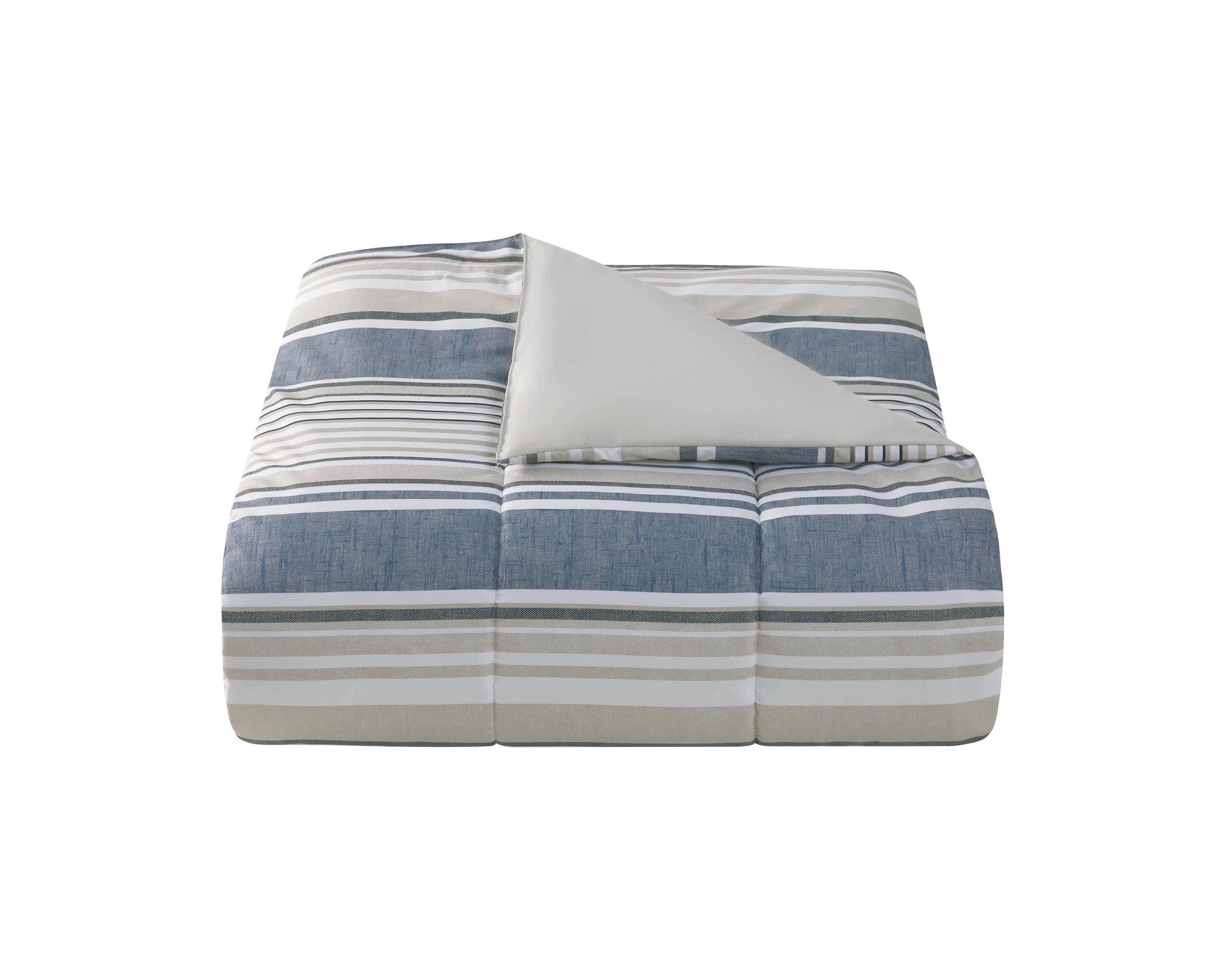 Refresh your space with the Easton Stripe 5pc Comforter and Quilt Set. Featuring classic stripes in blue, gray, and ivory, this set includes a cozy comforter, quilt, 2 shams, and a decorative pillow—perfect for effortless, layered style and year-round comfort.