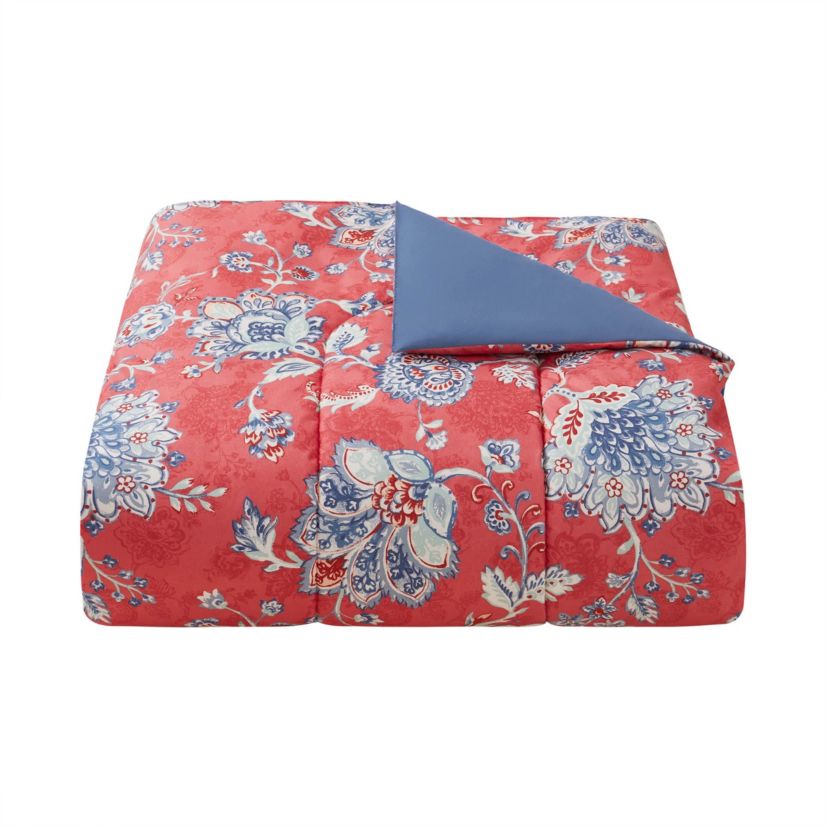 Brighten your bedroom with the Zinnia Blue 5pc Comforter and Quilt Set. Featuring a vibrant red floral print with a reversible blue quilt, this set includes a comforter, quilt, 2 shams, and a decorative pillow—perfect for bold style and cozy, layered comfort year-round.